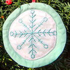 </p>
<p><center><a href="http://carolinapatchworks.com/blog/2012/11/13/aurifil-christmas-ornament-hop/" target="_blank">Emily Cier</a></center>